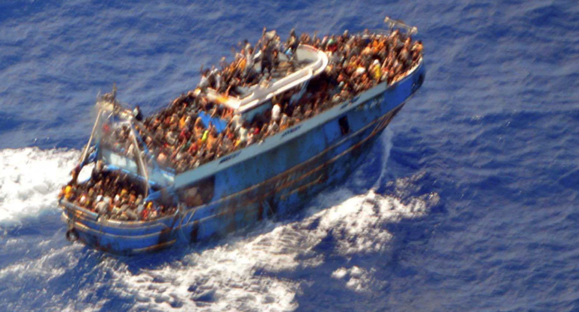 Hellenic Coast Guard/Reuters - A photo provided by the Hellenic Coast Guard shows migrants onboard the boat, before it capsized in the early hours of June 14.